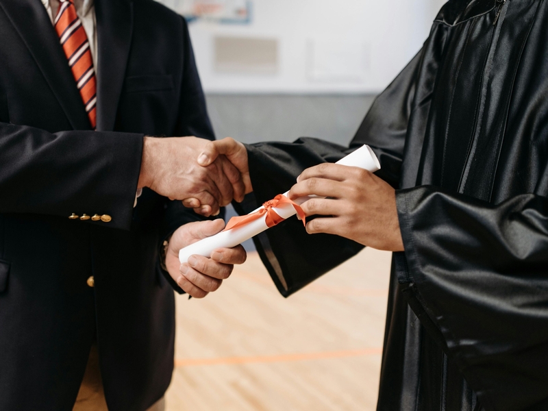 Girl in classroom raising hand
